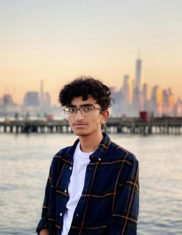 A photo of Ashwindev Pazhetma posing in front of the New York City skyline, used with his permission. 