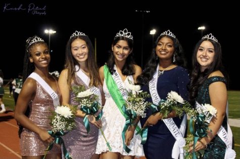 The 2021 Homecoming Queens pose at the game with winner Anusha Nayak pictured in white.