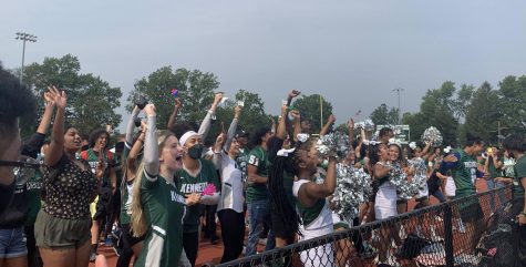 The JFK Mustangs show school spirit while rooting on their classmates.