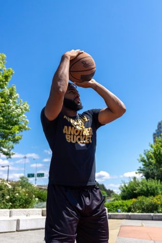 In this image, you see perfect form. The basketball is above the shooters head, there is one arm catapulting the basketball and the other arm leading. Photo Credit: photo via PNW Production under the Creative Commons License.