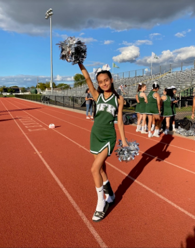 Senior Aashita Patel cheers for the JFK Mustangs.