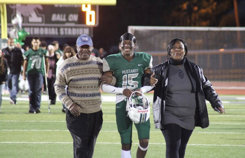 Keffa Marcellus with his mom and dad during senior night at JFK