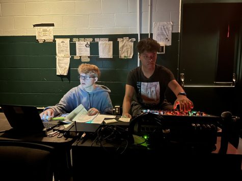 Ryan Sadowski and Mahir Rana work at the sound board to prepare for the Spring musical.