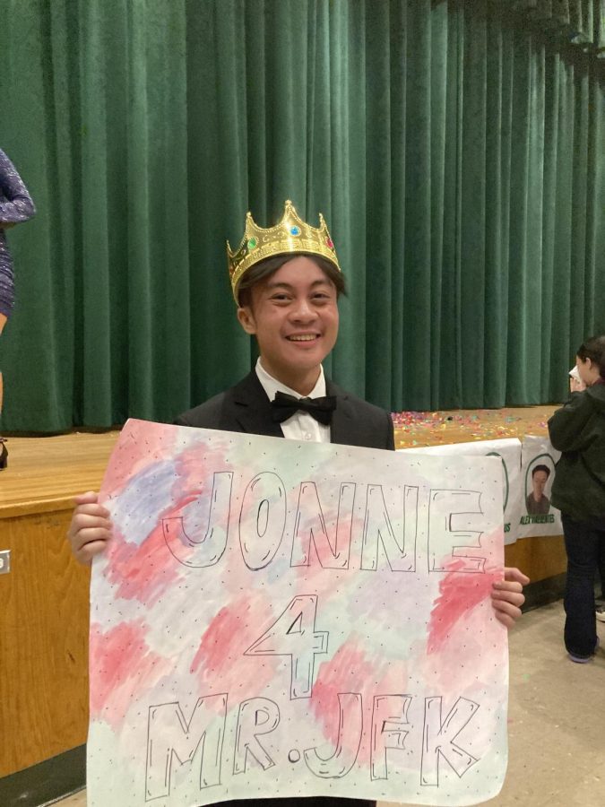 Jonne+Ramos%2C+winner+of+2023+Mr.+JFK+holds+a+sign+that+his+friends+made+to+support+him.