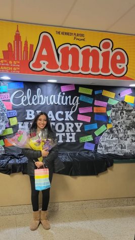 Anaina Vineeth and her beautiful smile in front of Annie banner