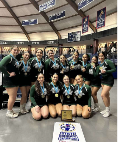 Competition cheerleaders on Saturday posing with their state championship title.