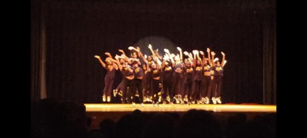 Dance 2R and 3R/4R performing the opening dance, “Let’s Go Crazy” by Prince in the auditorium of JFKMHS.