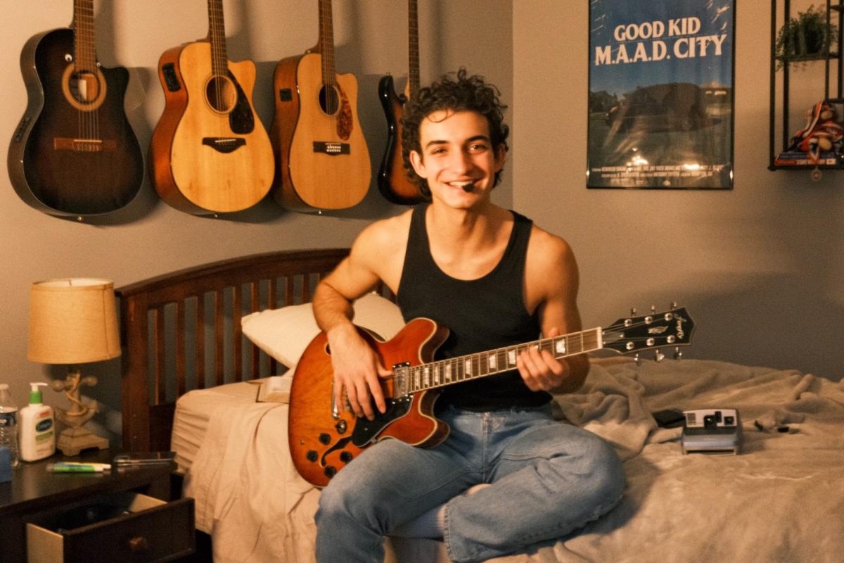 Petar poses with his guitar for a photo. Who wouldnt call him Americas Sweetheart? Photo Credit: Katelyn Figueiredo