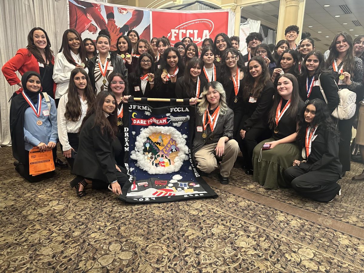 JFK's FCCLA chapter shows off their uniquely creative banner while attending a competition.