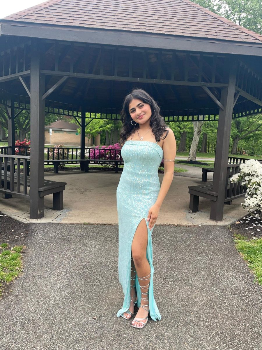 Outside at Merrill Park, Suhani poses for pictures before cotillion. 