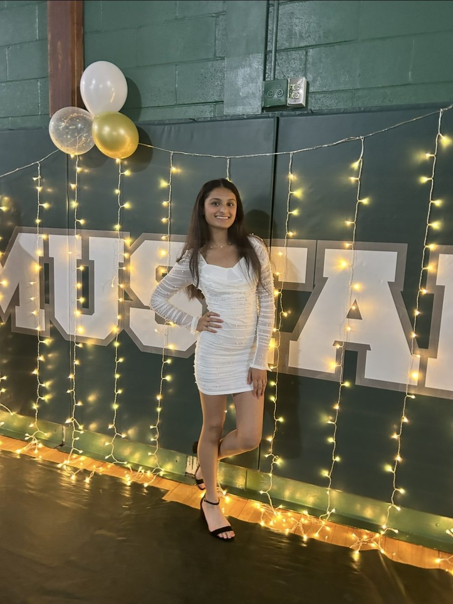Senior Nishi Dalia is dressed up and ready to make memories at JFK's first homecoming dance.