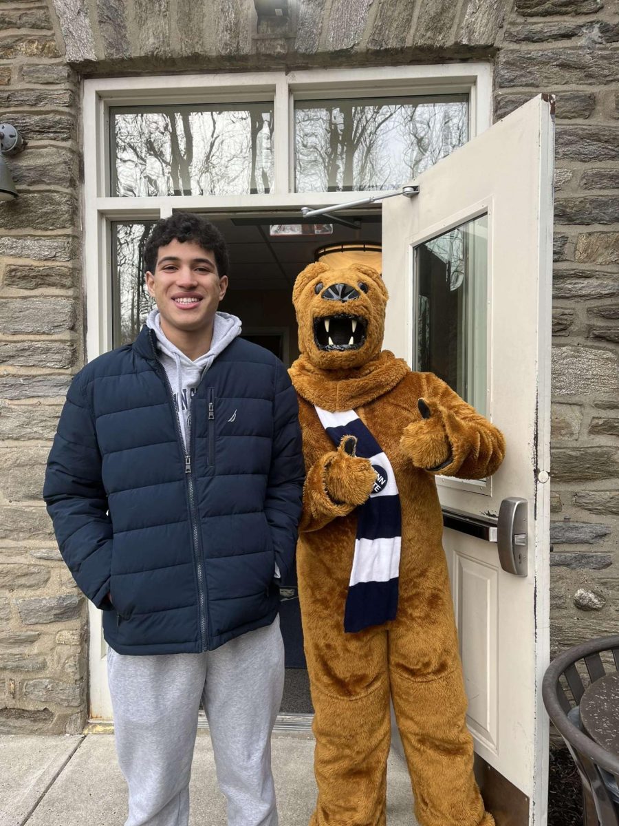 Gabriel Rodriguez posing with the Penn State mascot.