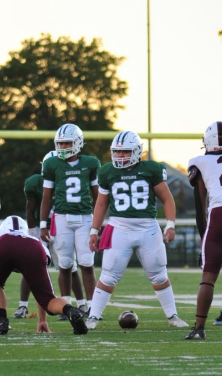 Brenden on the football field doing what he does best.