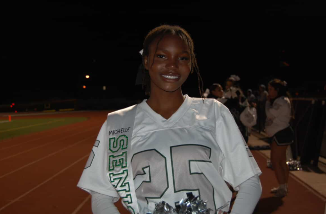 Graduating senior, at the track cheer meet. 
